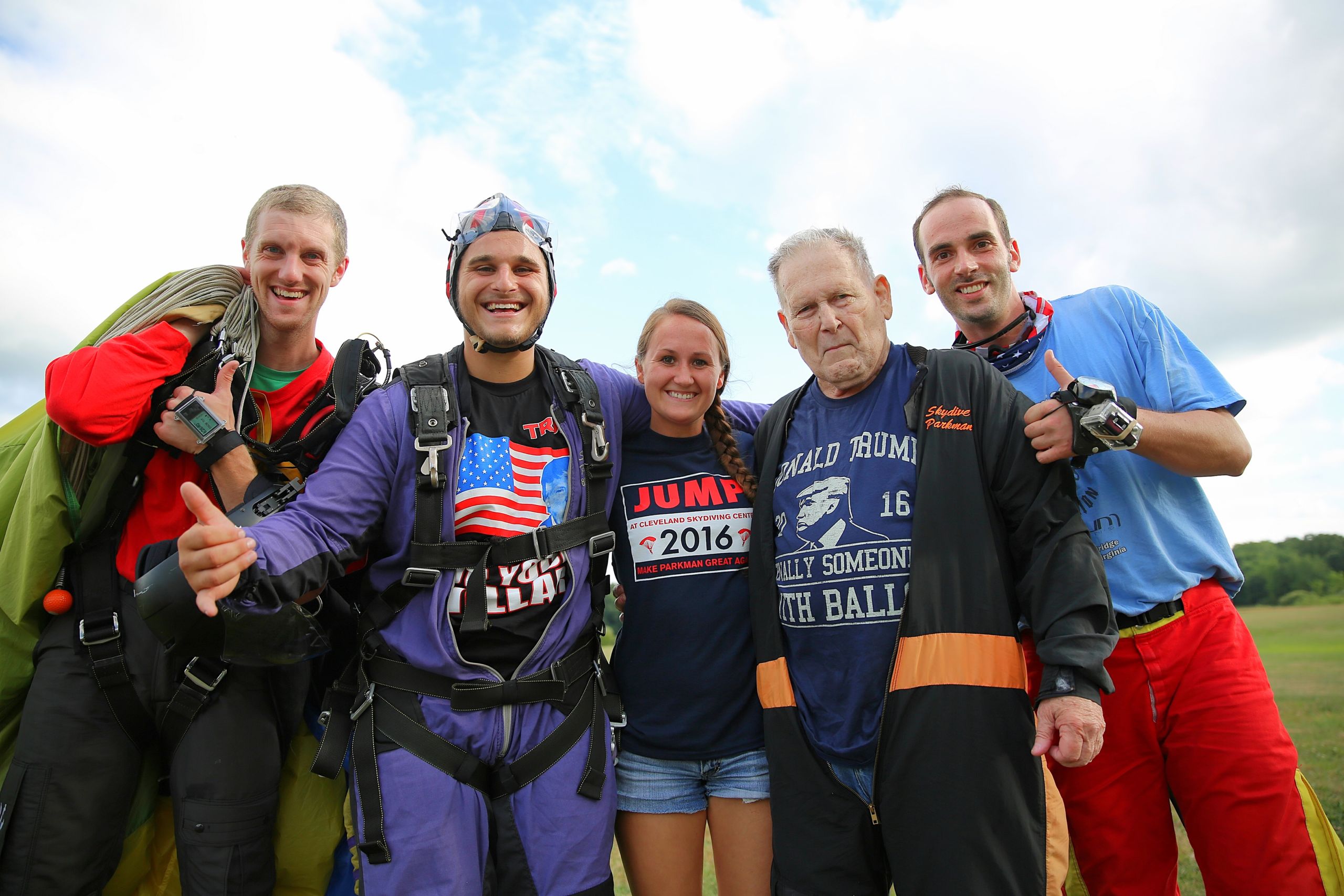 Mason Muldoon, second from left, and his grandfather Joe, second from right, with their jump instructors after completing skydiving jumps Saturday. (CJ photo by Don Carrington)