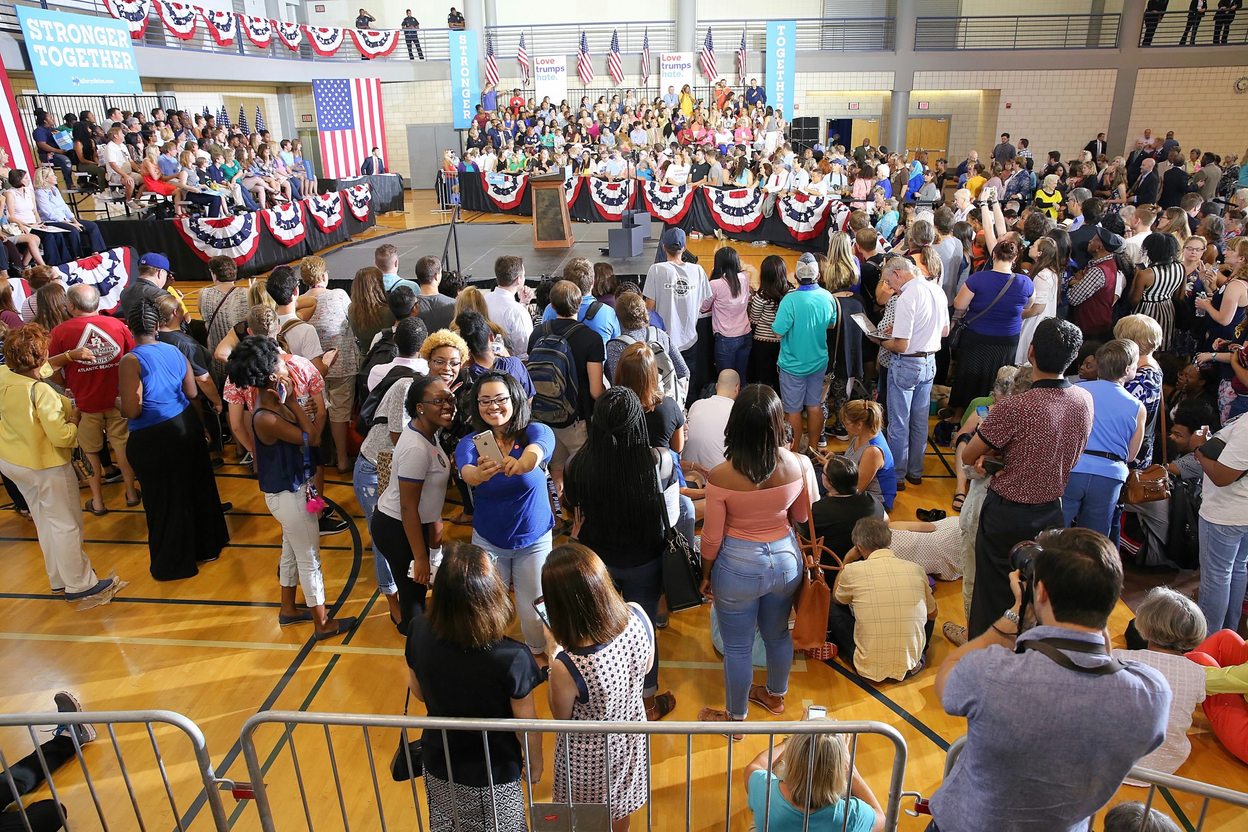 Backers of Democratic presidential nominee Hillary Clinton await the candidate's arrival Thursday afternoon on the UNC-Greensboro campus. (CJ photo by Don Carrington)