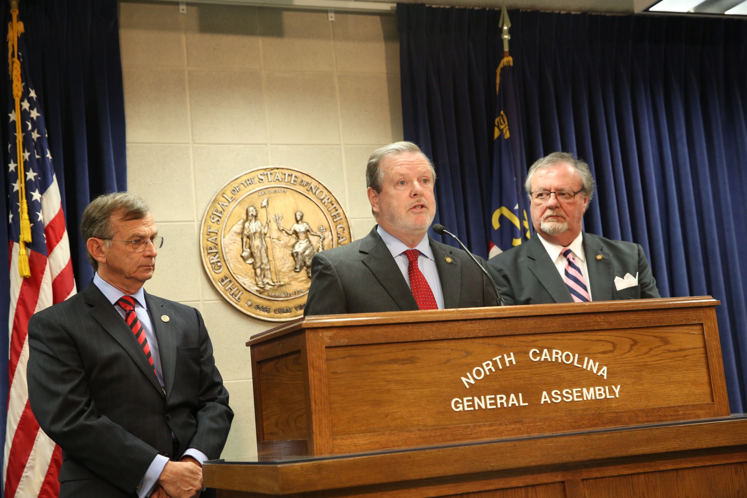 Senate leader Phil Berger, flanked by Sens. Bill Rabon (left) and Tommy Tucker (right), explain at a Feb. 23 press conference steps the Senate may take to compel Larry Hall's attendance at his confirmation hearing. (CJ Photo by Don Carrington)