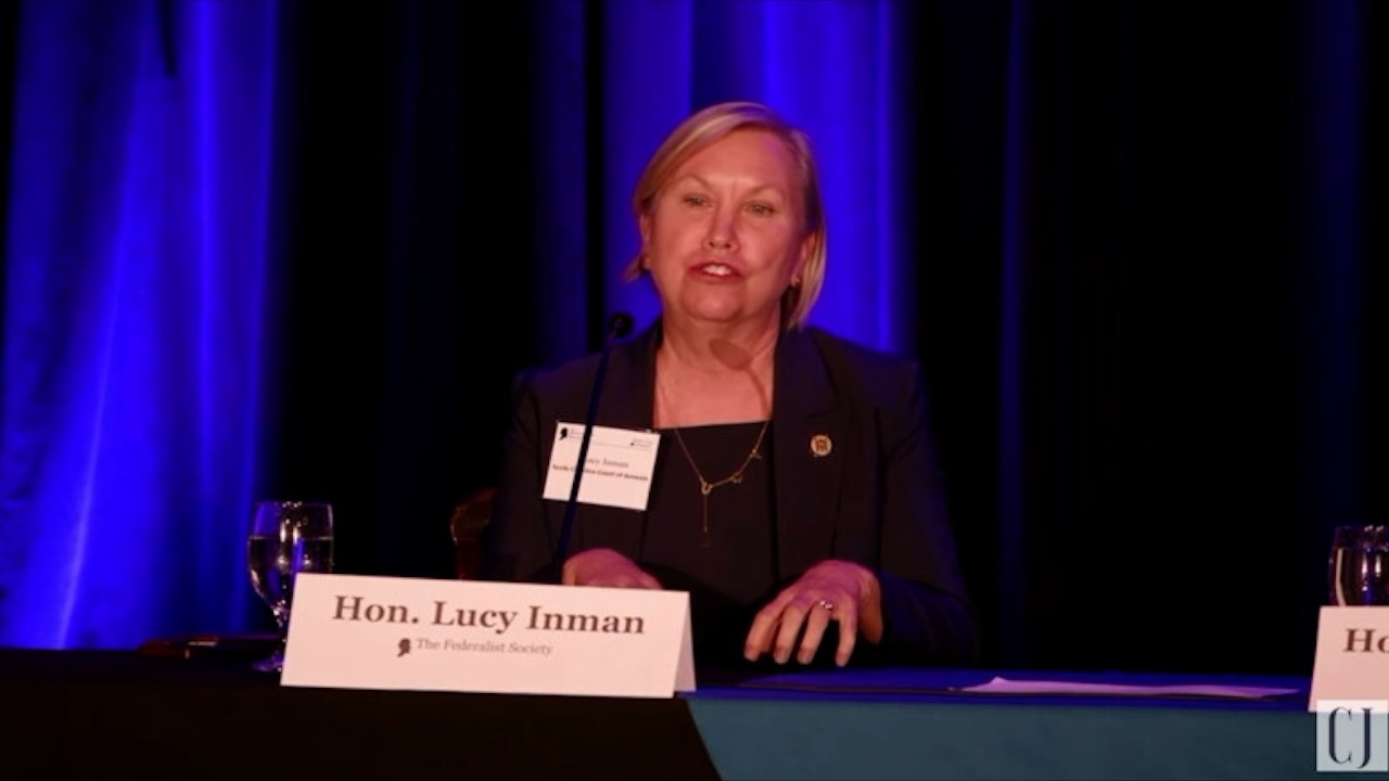 Lucy Inman speaks in forum