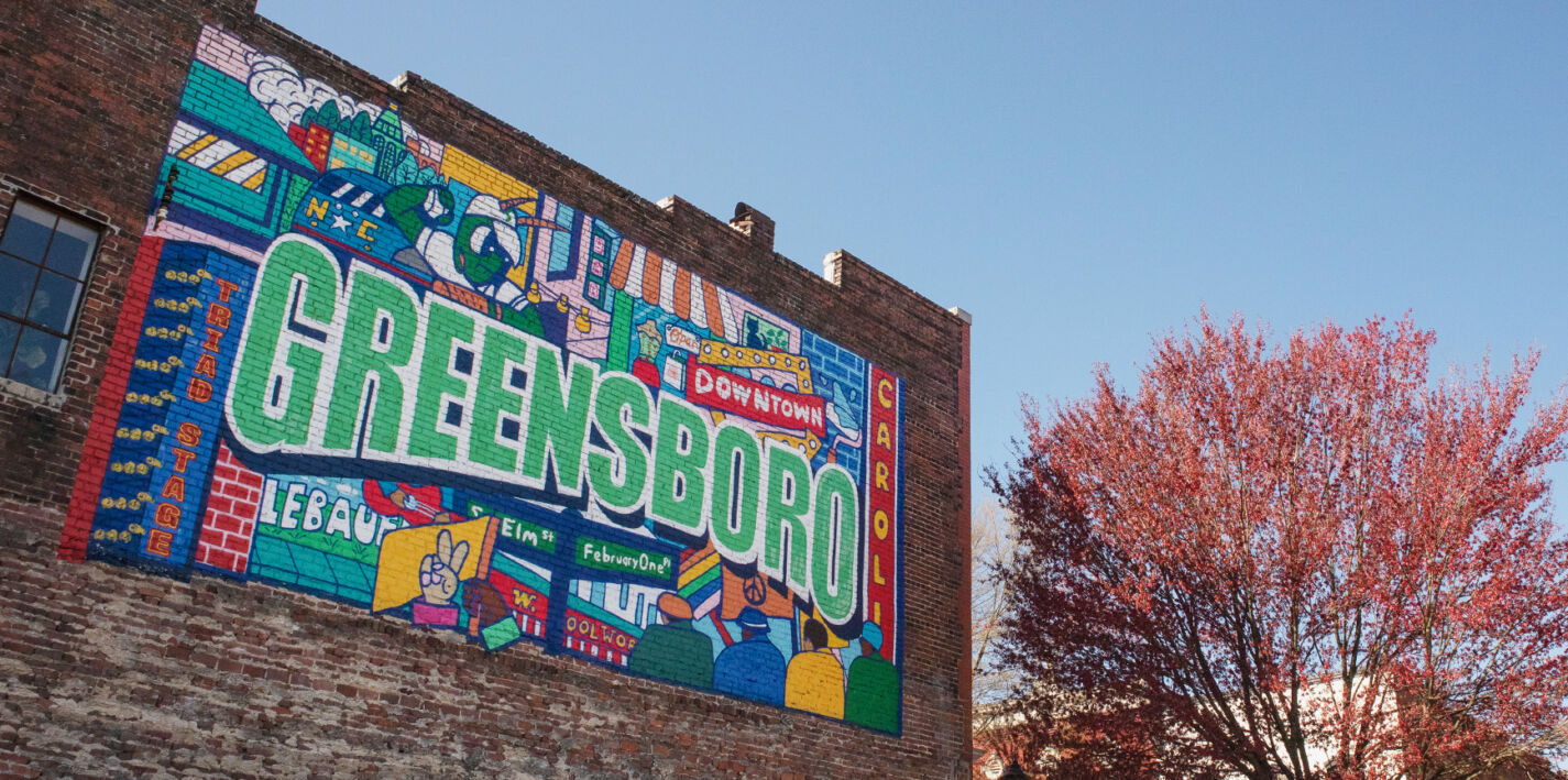 Greensboro mural on brick building