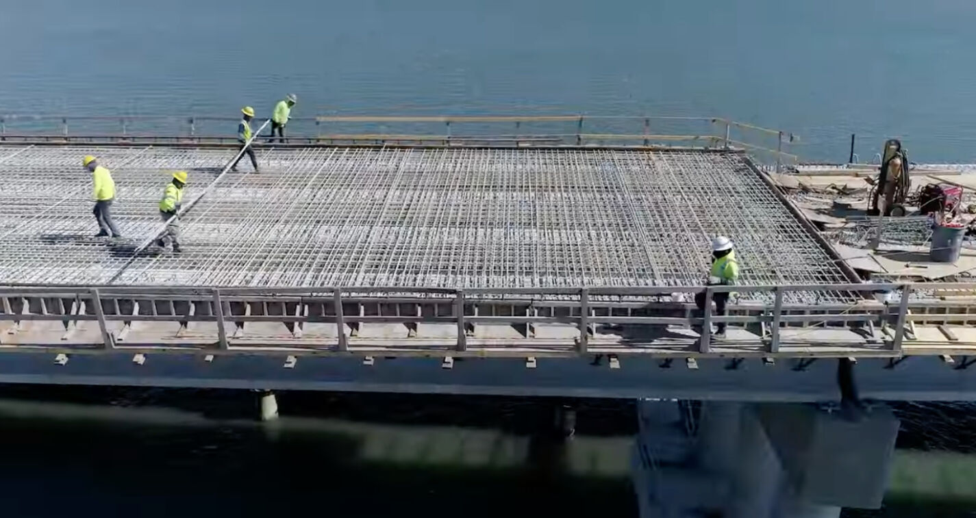 Harkers Island Bridge replacement workers moving material