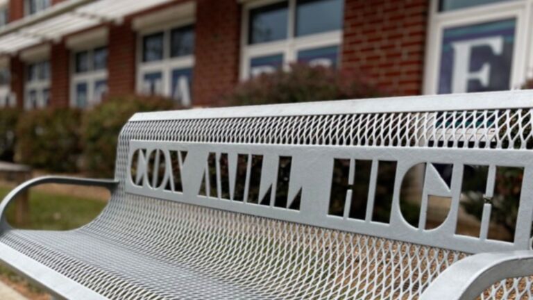 Bench in front of Cox Mill High School