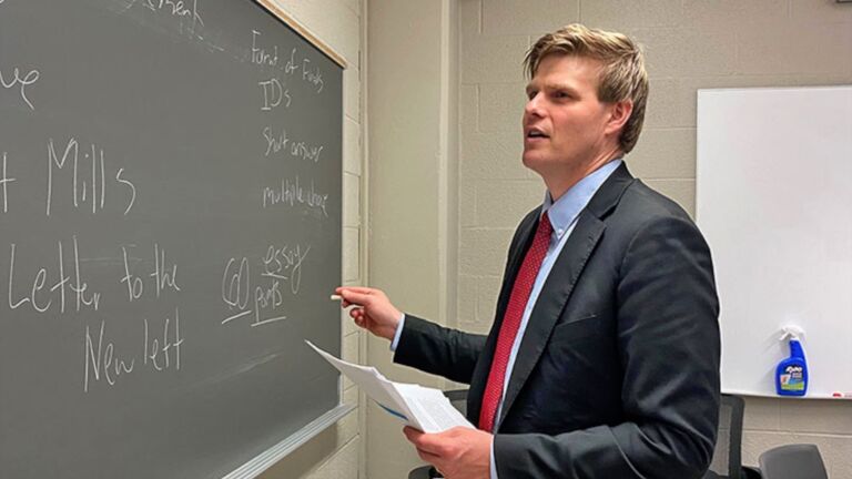 Jed Atkins of UNC's SCiLL looks at a chalkboard